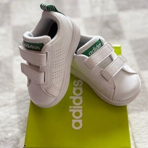 Kids Adidas white sneakers. Green stripe accent. Size 3K 9-12 months